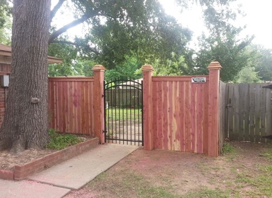 Custom wood fence iron gate